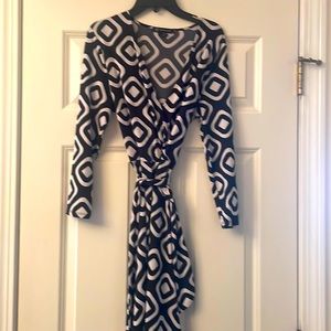 INC size medium, black, and white wrap dress
